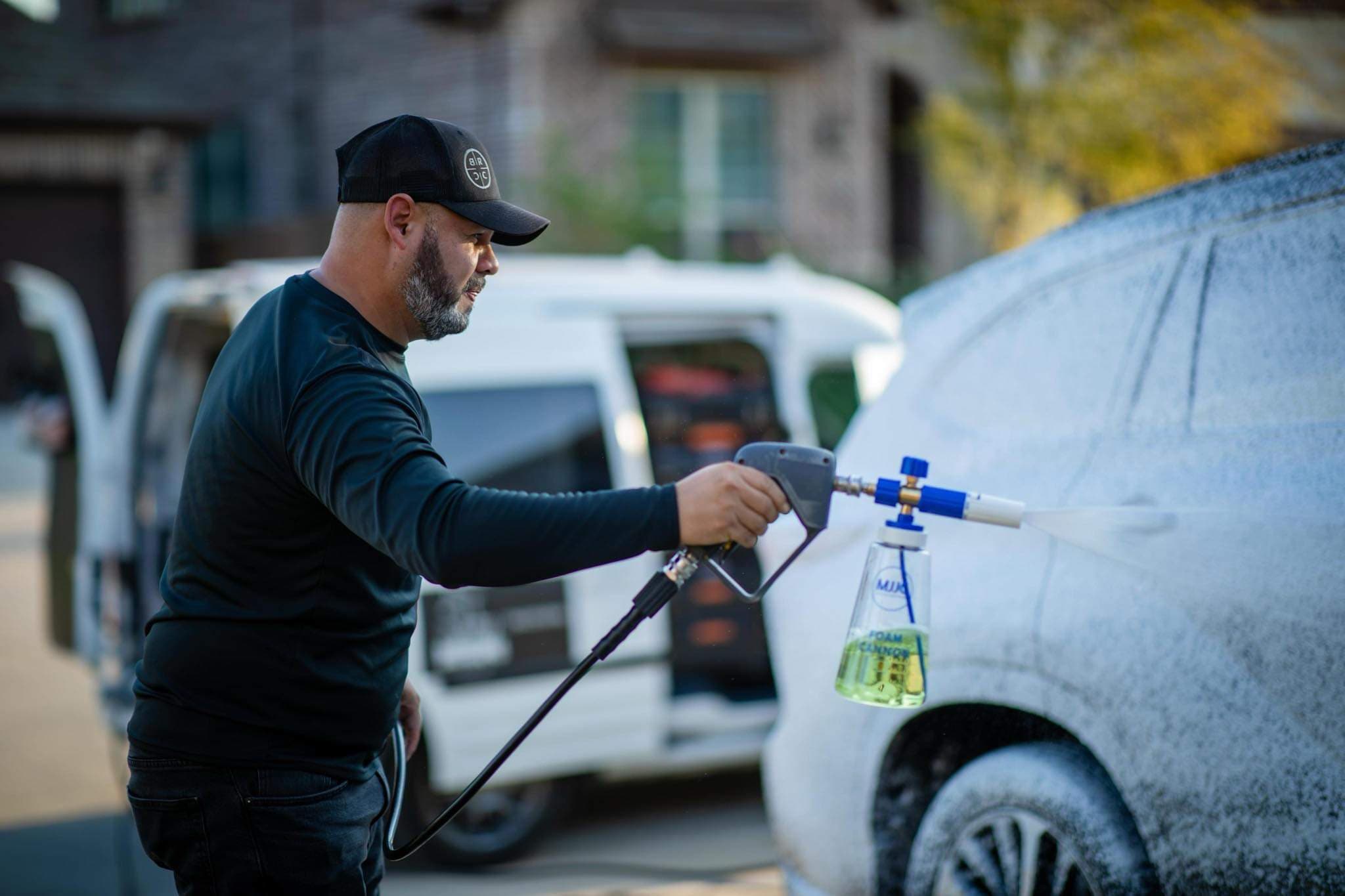 Revive technician applying foam to a vehicle in Forney